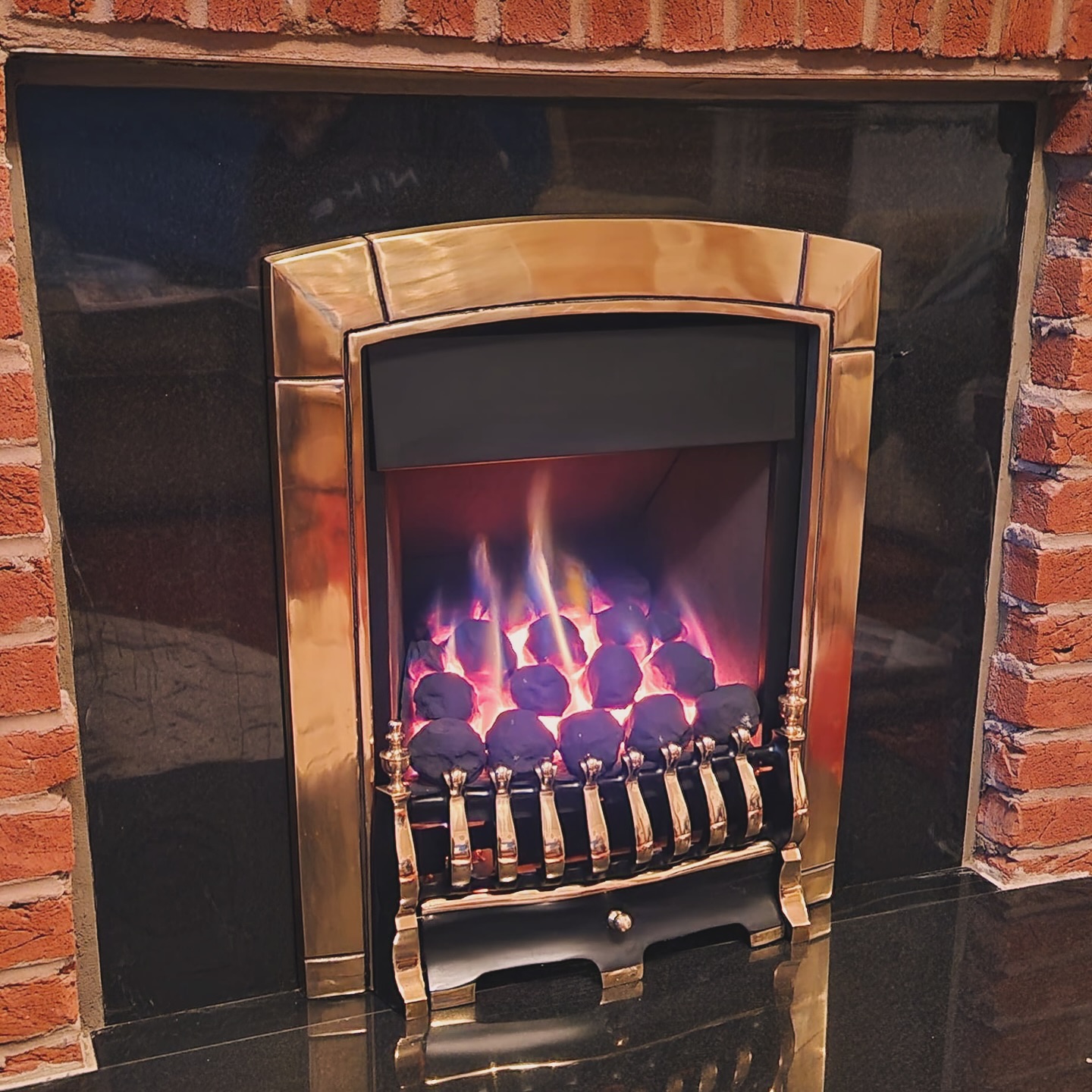 modern gas fires installed, lit fire